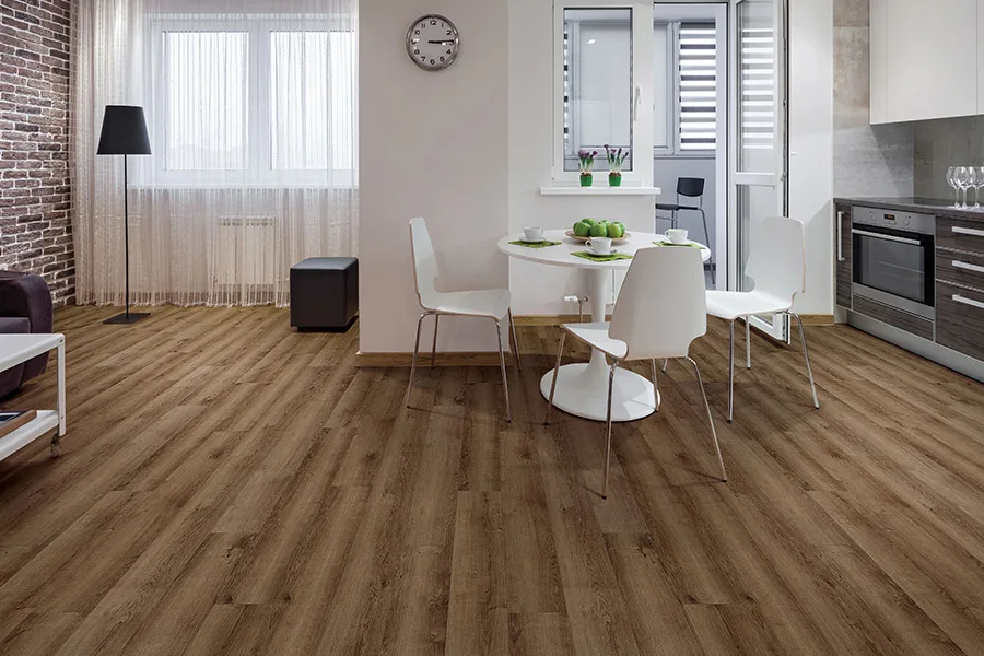 Professional vinyl floor wrapping over existing tiles for a quick and stylish home makeover.