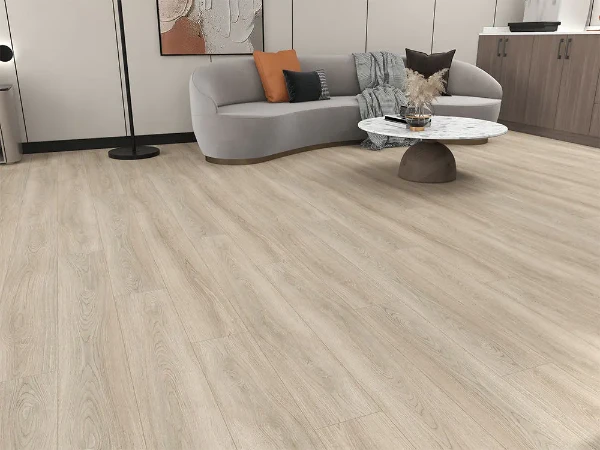 Gray oak wood-textured SPC flooring installed in a modern Dubai living room.